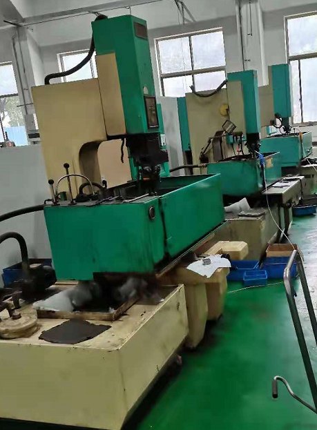 A row of sinker EDM machines