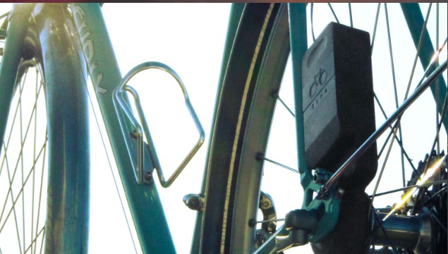 The generator mounted beside the rear wheel of a bicycle